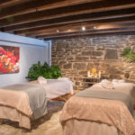 massage room at the spa with stone wall