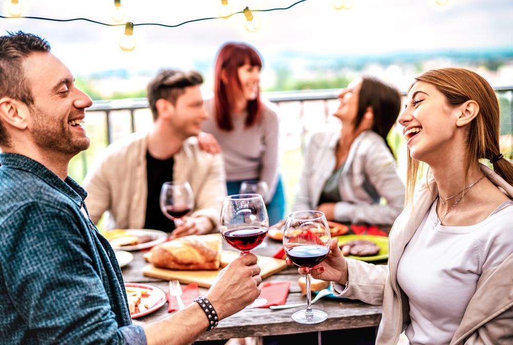 Things to do in the Finger Lakes, group of friends enjoying a beautiful meal outside