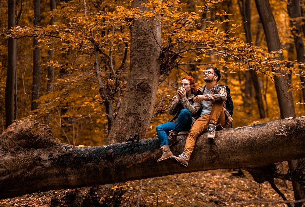 Finger Lakes Fall Foliage is such a beautiful back drop for your romantic getaways. Photo of a couple on a fall hike