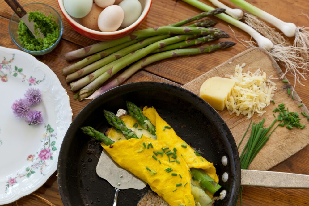 Asparagus omelette being plated at The Inn at Gothic Eves.